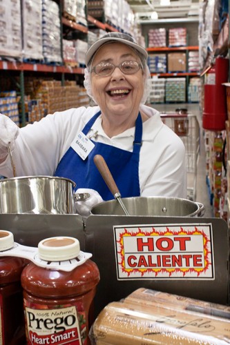 Barbara handing out samples of Prego Pasta Sauce at Costco.