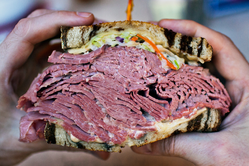 A giant Reuben with corned beef on rye. Editorial food photography at a local deli by Jackie Alpers for Tucson Guide Magazine.