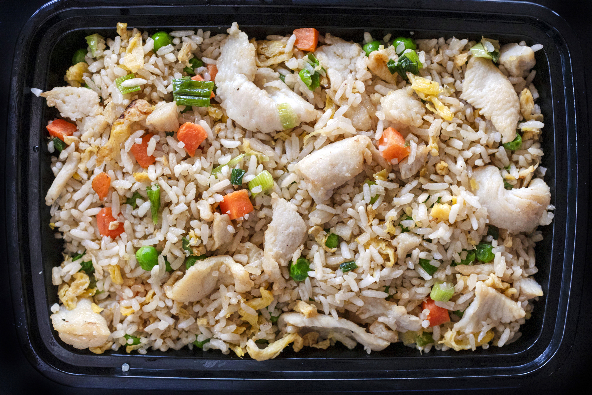 Chicken fried rice takeout from Asian Spice restaurant in Tucson, Arizona. Food photography for a feature article written by the photographer.